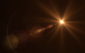 Warm-coloured light beam in black surroundings