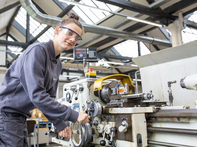Woman in front of machine