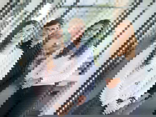 Woman wearing a light-coloured cotton jacket, man wearing a blue shirt