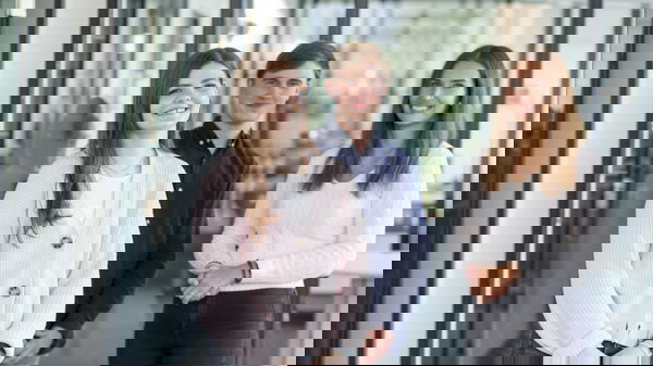 Woman wearing a light-coloured cotton jacket, man wearing a blue shirt