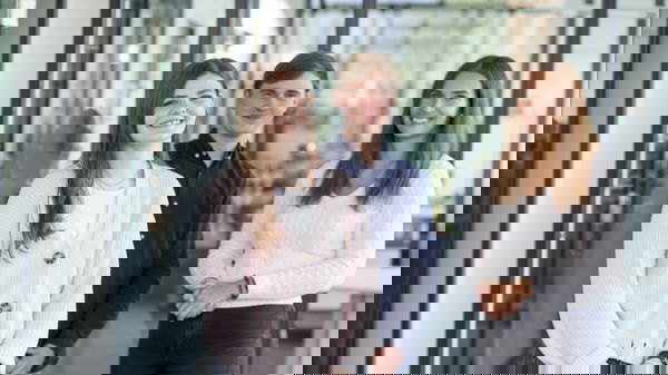 Woman wearing a light-coloured cotton jacket, man wearing a blue shirt