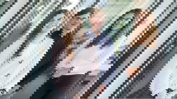 Woman wearing a light-coloured cotton jacket, man wearing a blue shirt