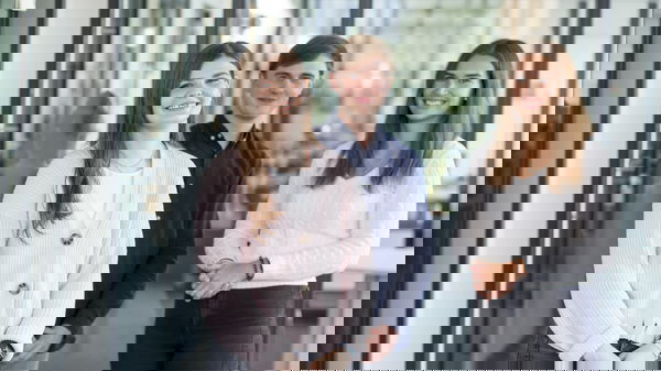 Woman wearing a light-coloured cotton jacket, man wearing a blue shirt