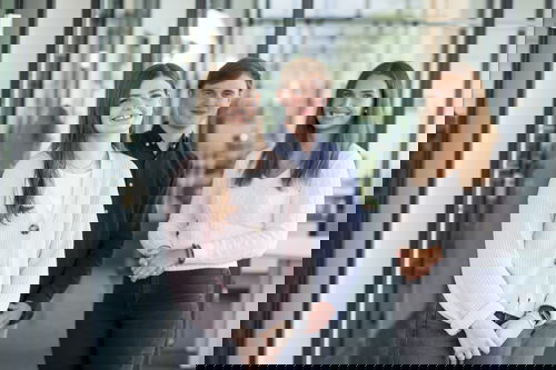 Woman wearing a light-coloured cotton jacket, man wearing a blue shirt