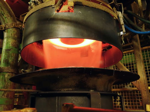 Melting furnace in an industrial setting