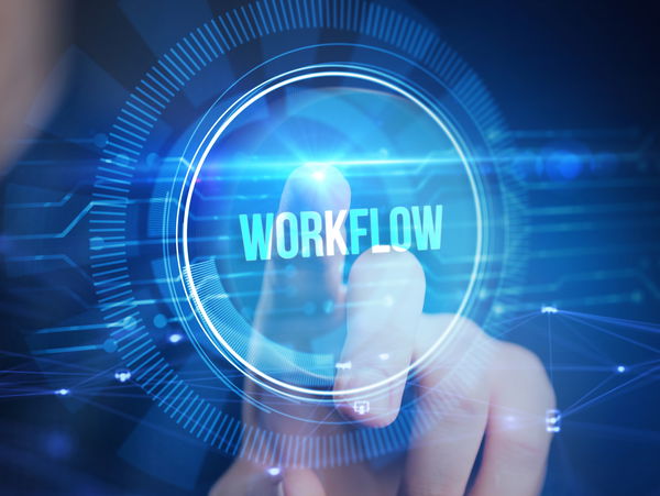 Hand pointing to holgraphic workflow symbol