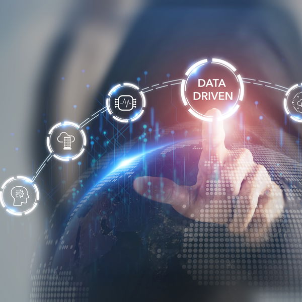 Finger points to hologram with inscription Data Driven