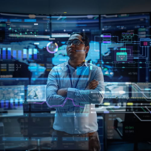 Man in front of holographic wall and statistics