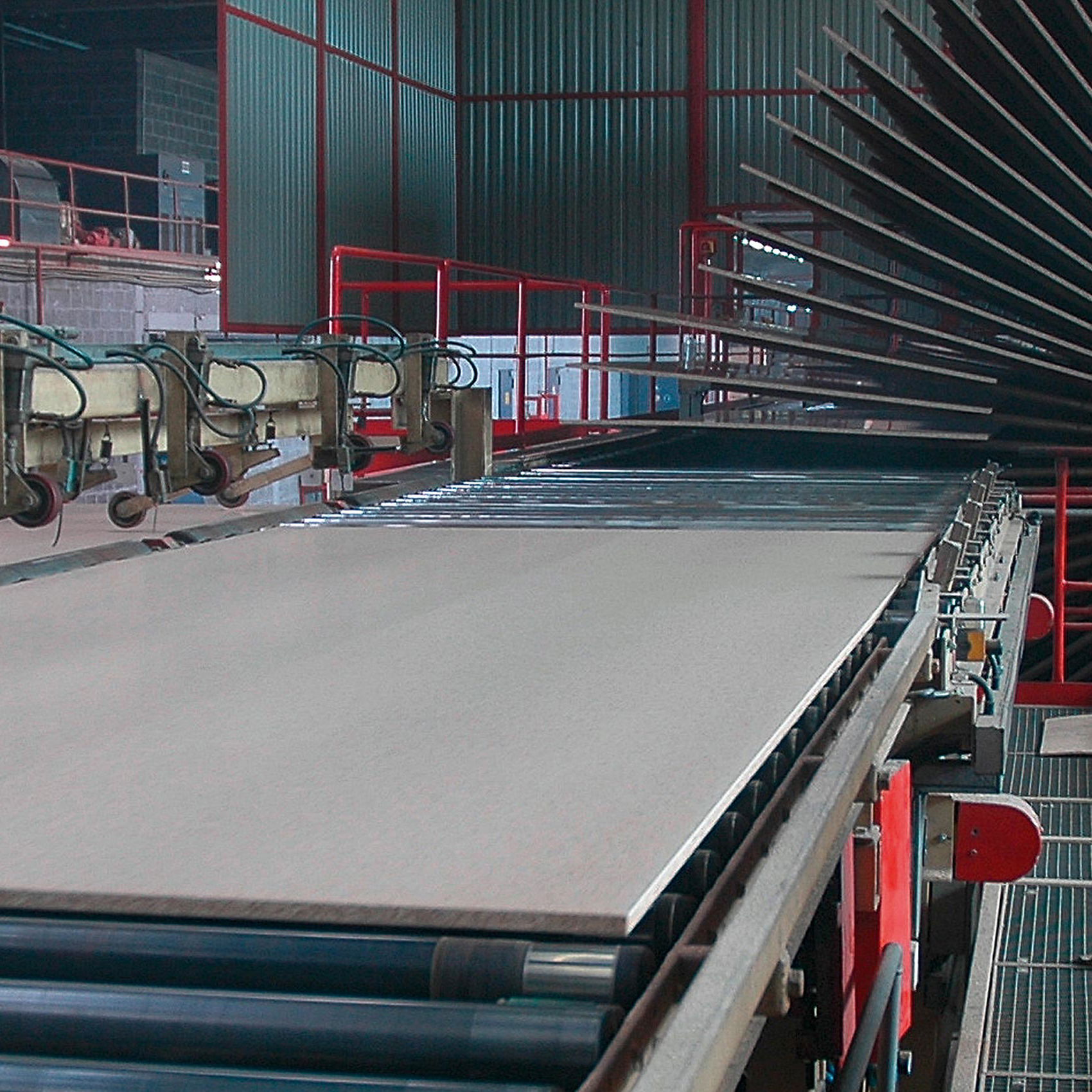 Inline weight measurement of wooden panels using load cells on the production line.