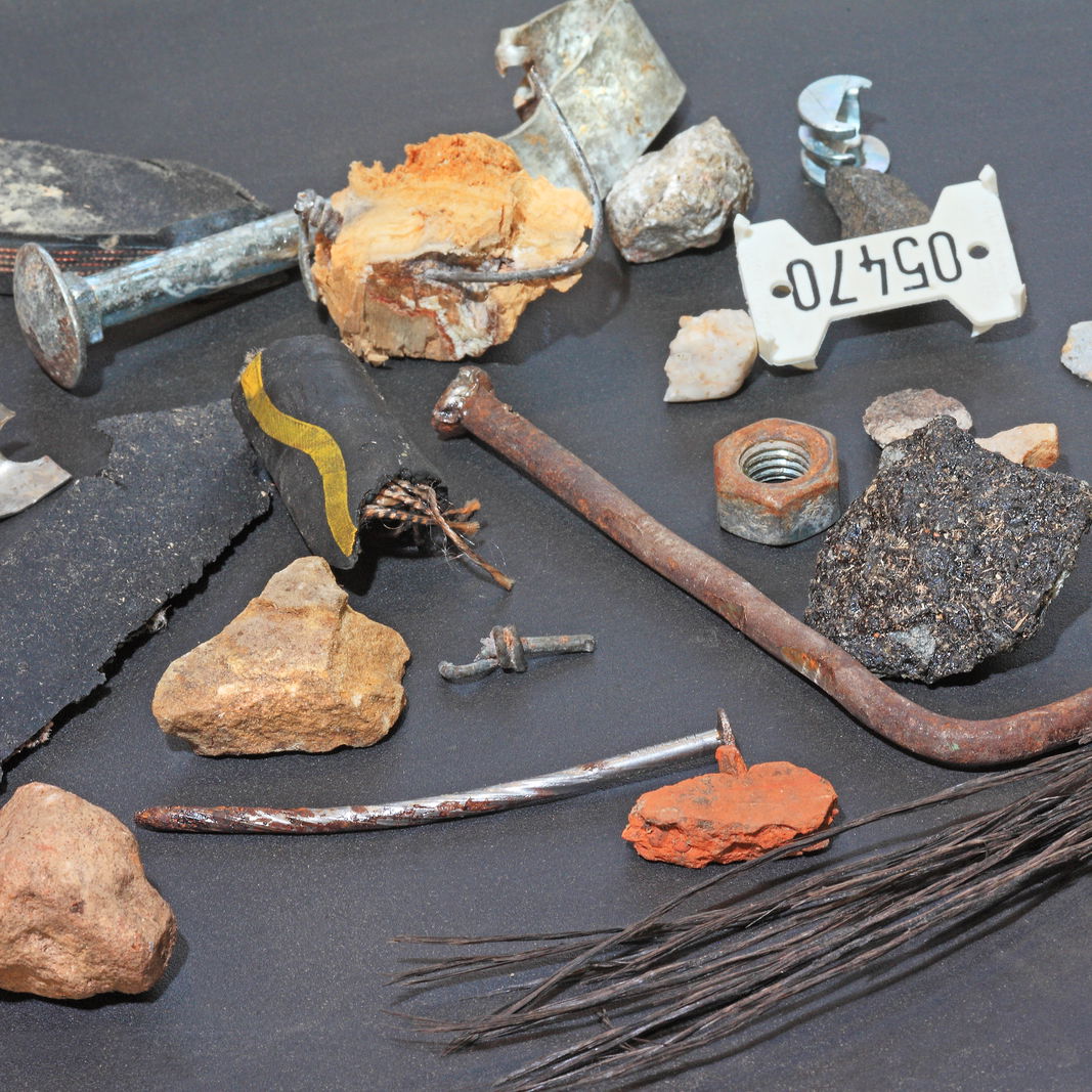 Foreign objects such as rusty nails, stones, screws or plastic.