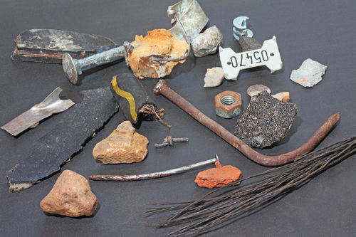 Foreign objects such as rusty nails, stones, screws or plastic.