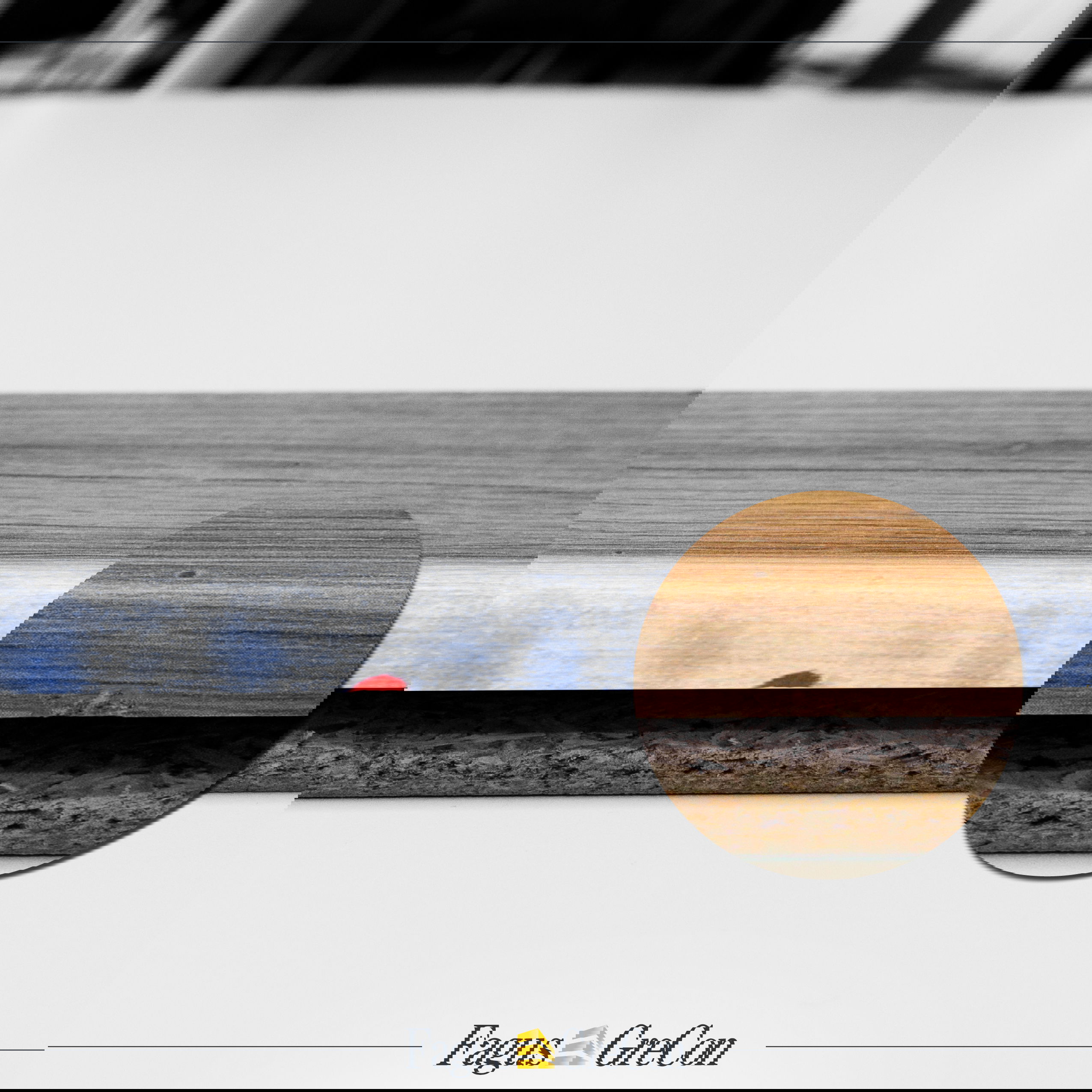 Minimal damage to a wooden board, highlighted in red and magnified with a magnifying glass