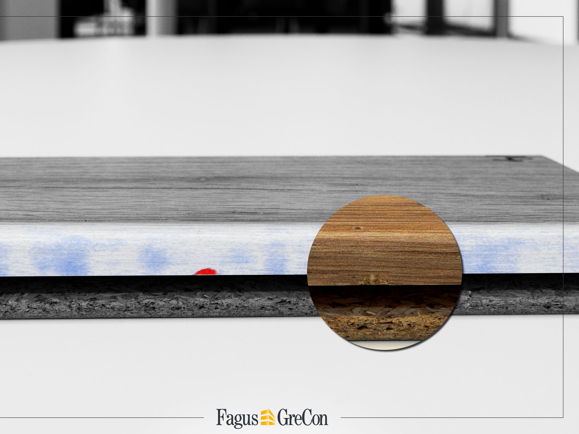 Minimal damage to a wooden board, highlighted in red and magnified with a magnifying glass