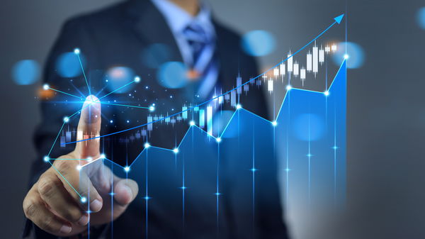 Man in a suit operating a luminous scale with his finger